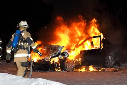 This is a photo of recue workers putting out a car fire. rescue workers respond to auto accidents, but you need a Car Accident Attorney to protect your rights.