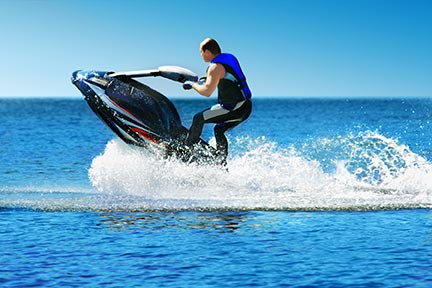 Many people like to do tricks on jet skiis like seen in this picture, however, these tricks often lead to injuries and boating accidents.
